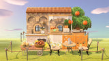 Animal Crossing Petite Bakery room design with a stone building, covered counter of bread, orange tree, cafe table and garden chairs behind a rope fence