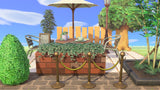 Animal Crossing Coffee Canopy room design with a bistro table under a parasol, coffee cup, metal and wood chairs, menu chalkboard and an ivy covered brick planter